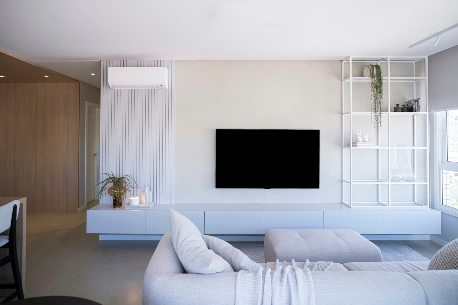 Large TV wall-mounted flat and level in an Austin living room by ATX Mount Pros, with no wires visible on the wall